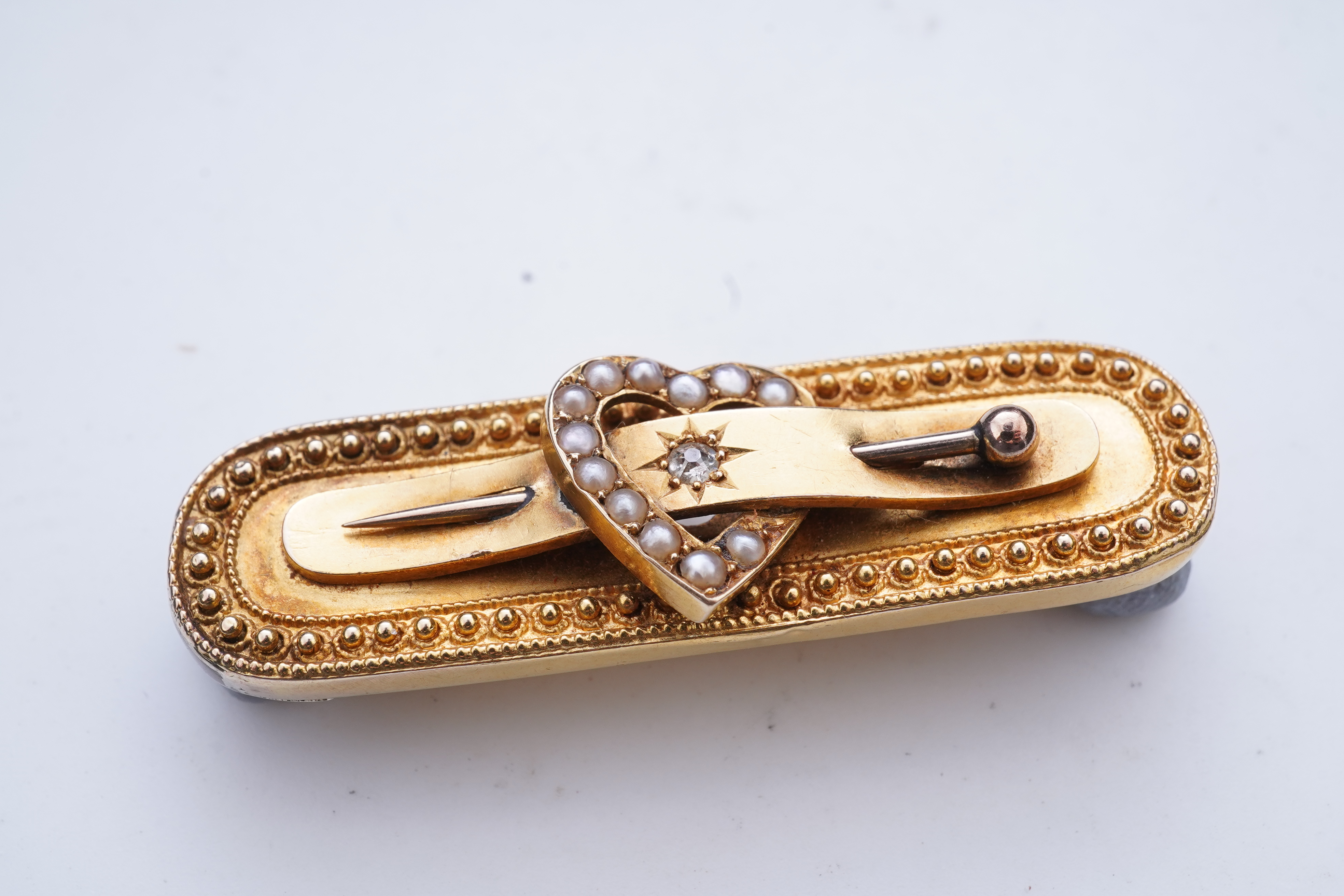 An Edwardian gold and seed pearl brooch, circa 1896